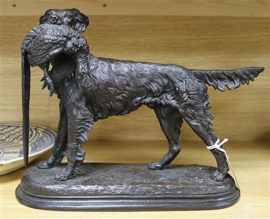 After Jules Moigniez (1835-1894). A bronze model of a Retriever carrying a pheasant, length 38cm